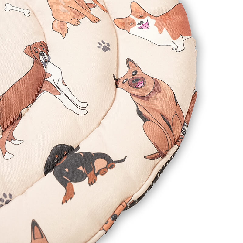 Close-up of the Dog Daze pet mat showing the soft quilted fabric with playful illustrated dog prints, highlighting stitching quality, cushioning, and durable edge finishing.